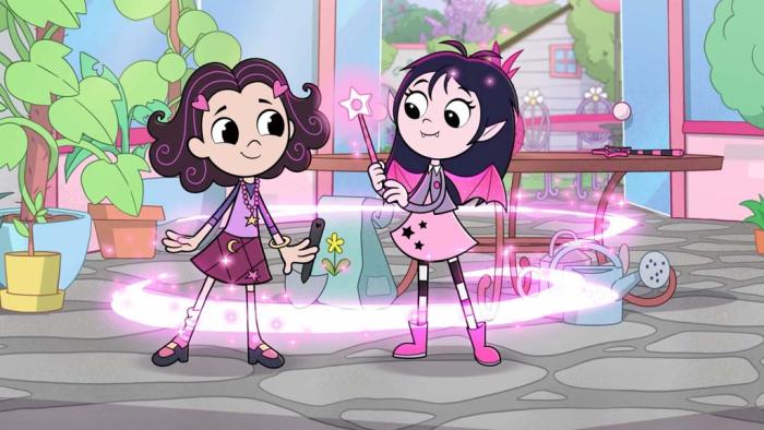 Isadora Moon TV show screenshot 2: Isadora does magic with her friend Zoe. A twirl of while light revolves them.