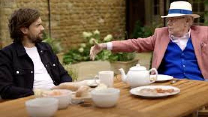 Jack Whitehall: Fatherhood with My Father TV show screenshot #1: Father and son sit at a dining table outside