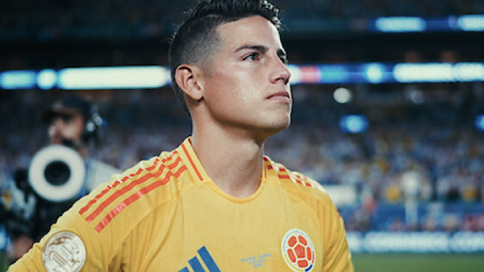 James. screenshot 1: James Rodríguez in yellow jersey on field, focused expression.