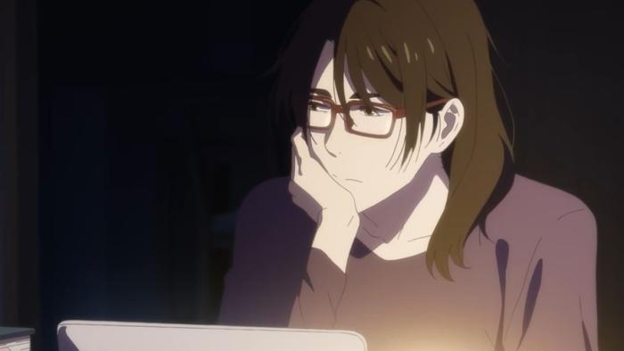 Journal with Witch TV show screenshot 3: Maiko sits in the dark with her laptop, staring off in the distance thoughtfully