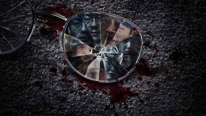 Karma TV show screenshot: A shattered pair of glasses lays on the stone with many people in the lense.