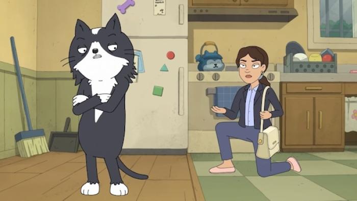 Kevin TV show screenshot 1: Kevin stands in a kitchen with his back to Dana, who holds a purse and is on bended knee, pleading to him