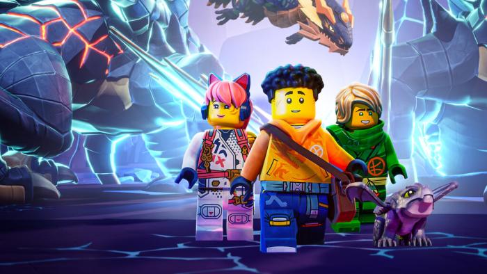 Ninjago Dragons Rising TV show screenshot 1: Three Lego figurines walk together.