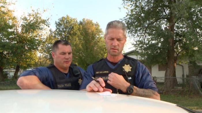 Live PD TV Show: Two officers checking information