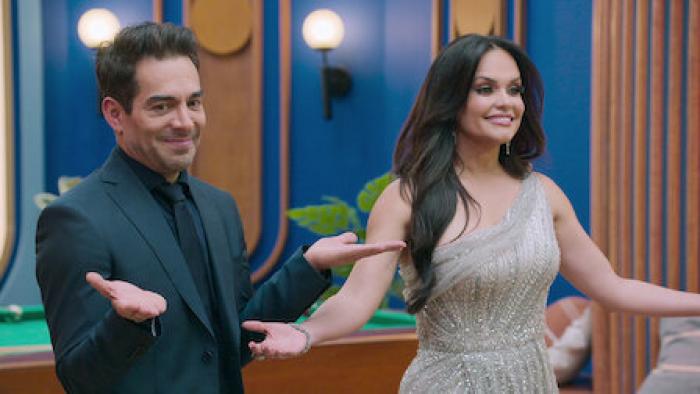 Love is Blind: Mexico TV show screenshot 1: Lucy and Omar Chapparo stand side-by-side with open arms and smiling