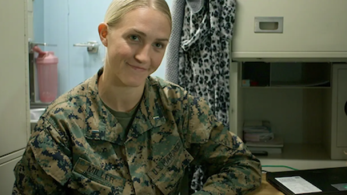 Marines TV show screenshot 1: Lt. Samantha Miller sits in fatigues.