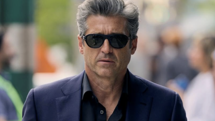 Memory of a Killer TV show screenshot 1: Angelo Doyle in black suit and dark sunglasses. 