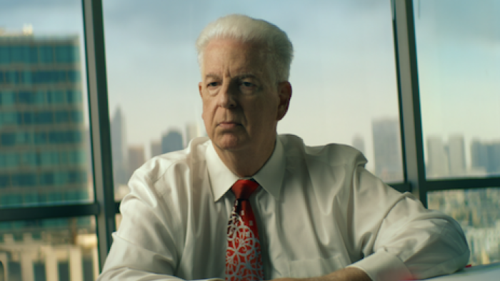 Michael Jackson: The Verdict TV show screenshot 2: Brian Oxen in an office with a cityscape view.