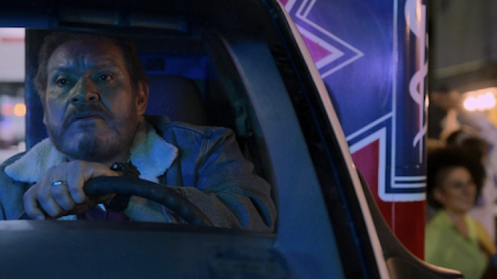 Midnight Family screenshot 2: Ramón drives ambulance through crowd.