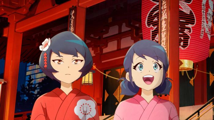 Miraculous World Tokyo Stellar Force TV show screenshot 3: Kagami and Marinette look in the distance wearing Japanese kimonos in a Tokyo square.