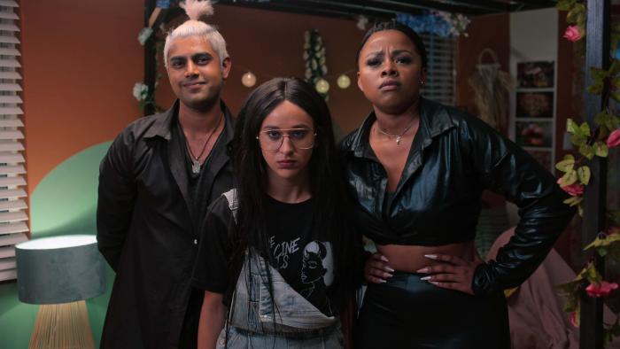 Miseducation TV show screenshot 1: Prev Reddy, Micaela Tucker, and Buntu Petse stand together, all dressed in black clothing.