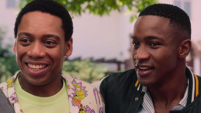 Miseducation TV show screenshot 3: Sechaba Ramphele and Lunga Shabalala smile while standing side by side.