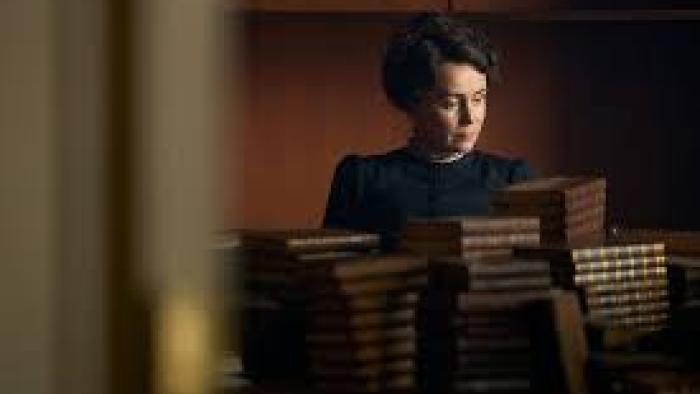 Miss Austen TV show screenshot #1: Austen sits at a table