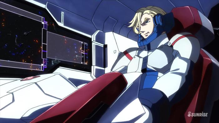Mobile Suit Gundam Iron blooded Orphans TV show: A man with blonde hair wearing a red, white, and blue space suit is seen in a cockpit, piloting a futuristic vehicle or mech.