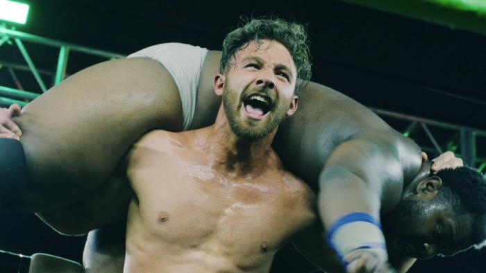 Monster Factory TV show screenshot 1: wrestler Goldy carries a man on his shoulders