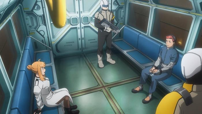 Moonrise TV show screenshot 3: Jack, in handcuffs, sits across from Inanna in a train car. A guard holding a laser gun stands watch.