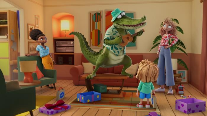 Mr. Crocodile TV show screenshot 3: Mr Crocodile sings a birthday song to Daisy while her mom and stepmom watch happily from the sides.