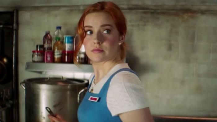 Nancy Drew TV Series: In her blue waitress uniform, Nancy stares at something alarming off-screen. 