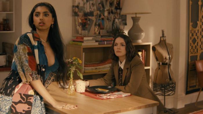 Not Suitable for Work TV show screenshot 3: Abby and AJ stand on either side of a kitchen counter; a mannequin dummy is behind AJ