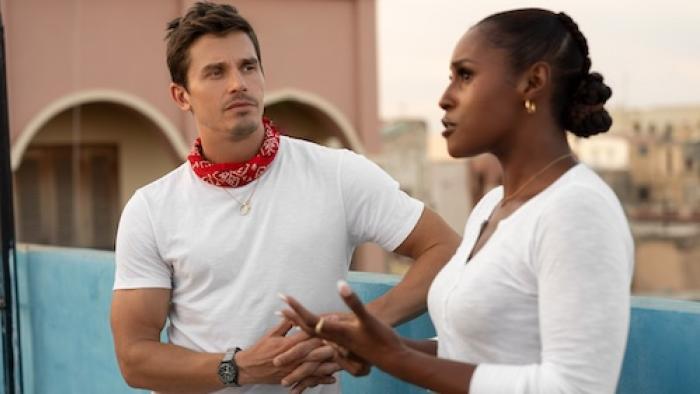 No Taste Like Home with Antoni Porowski TV show screenshot 2: Porowski listens intently to Issa Rae, who is speaking and gesticulating with her hands.
