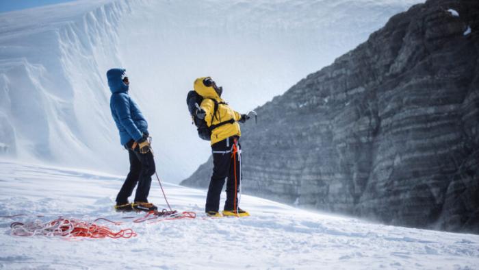 Pole to Pole with Will Smith TV show screenshot 3: In the South Pole, Will Smith and an explorer seize the moment after climbing an ice wall.