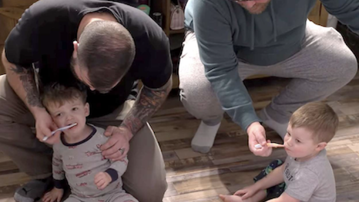 Polyfamily TV show screenshot 2: Tyler and Sean brush toddler boys' teeth.