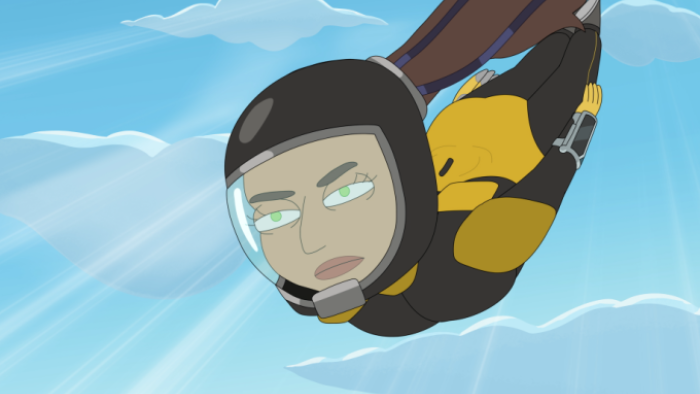 President Curtis TV show screenshot 2: Banks is shown skydiving, wearing a yellow uniform and safety helmet, against a clear blue sky