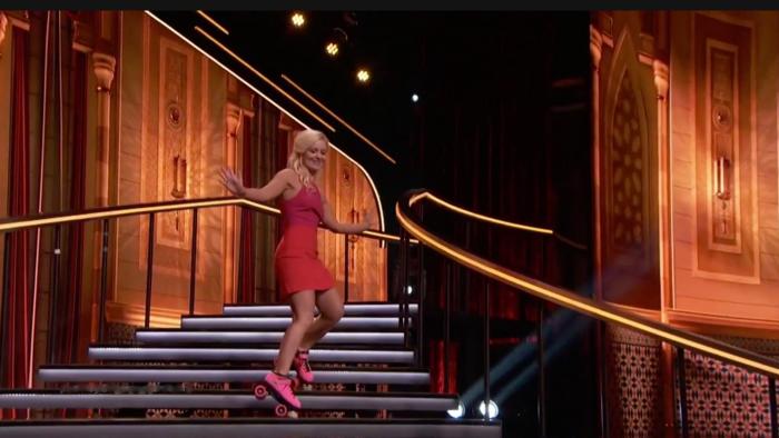 Coming down the stairs in roller skates. 