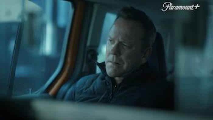 Rabbit Hole TV show: Kiefer Sutherland sits in the back of a taxi next to the window