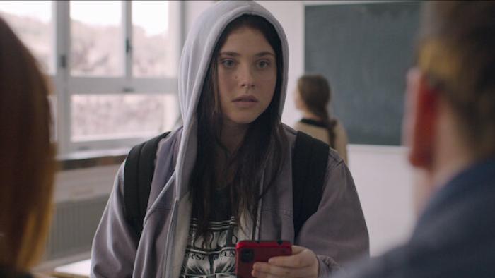Raising Voices: A closeup of a teenage girl in a hoodie.