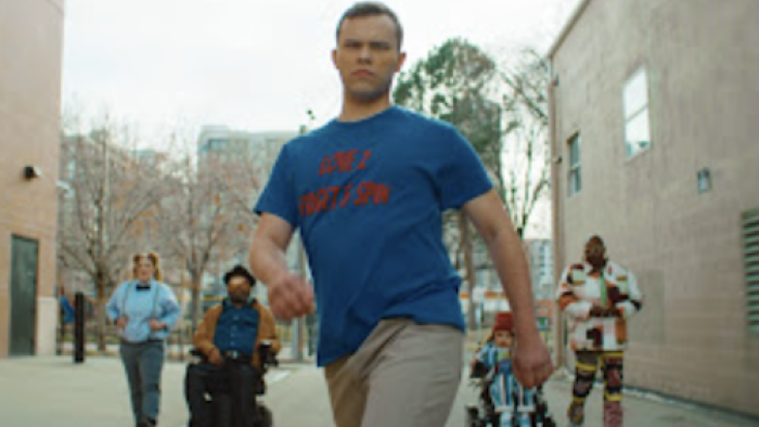 Reframed: Next Gen Narratives TV show screenshot 2: Josh Allege as Jack wears blue shirt and walks.