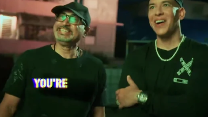 Reggaeton: The Sound that Conquered the World screenshot 1: Daddy Yankee and friend check out their old neighborhood in Puerto Rico.