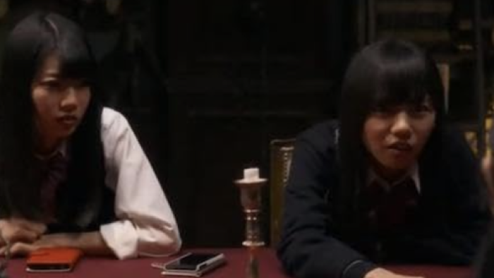 Re: Mind TV show screenshot 2: Kyoko and Ayaka sit at the dining table with their phones. 