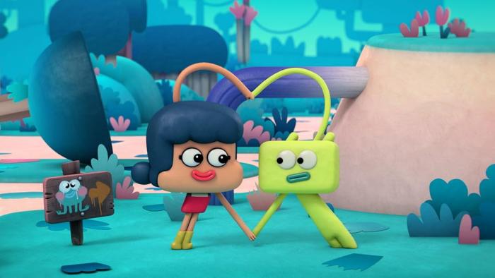 Roger TV: Fatou and Roger use their arms to form a heart shape in a colorful tropical setting.