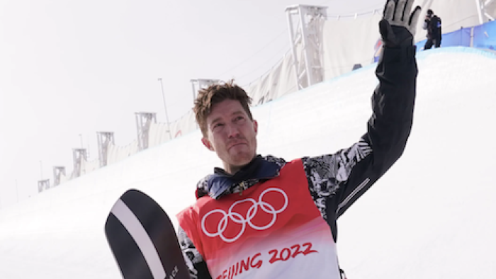 Shaun White: The Last Run TV show screenshot 3: Shaun White waves from snowy mountain at Beijing Olympics.