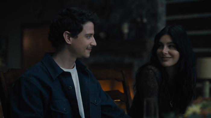 Adam DiMarco and Camila Morone. DiMarco wears a blue jacket and white t-shirt. Morrone wears a dark sweater.
