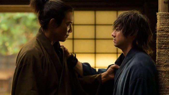 Song of the Samurai TV Show screenshot 2: Kondo and Hijikata stand in a tense emotional confrontation, gripping each others’ robes