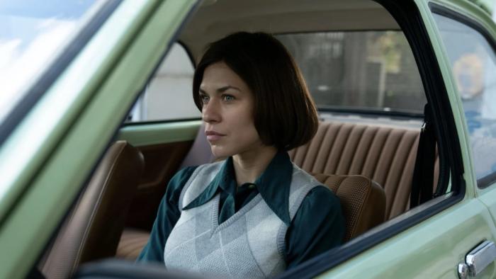 Spy/Master: a female agent waits in a car