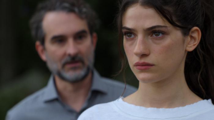 Sterling Point TV show screenshot 1: Closeup shot shows Annie looking as if she's about to cry, with Steven just behind her, mid-sentence