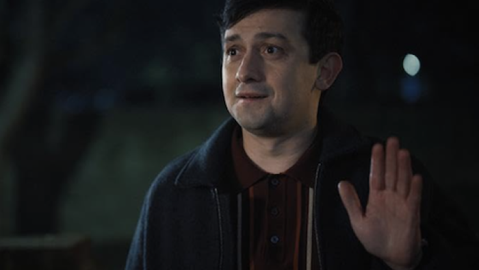 Still Up TV show screenshot 2: Danny (Craig Roberts) stands and waves in the dark.