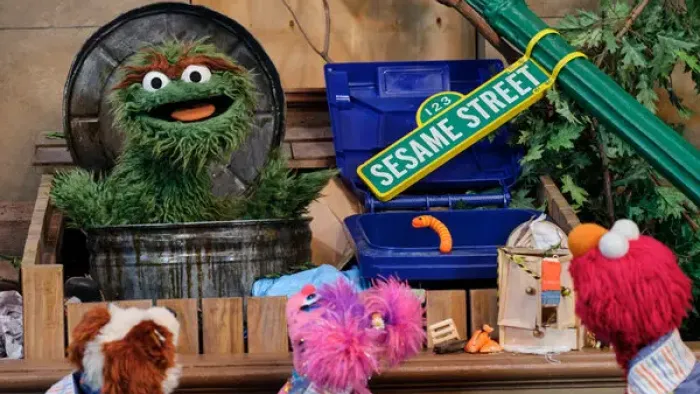 Storm On Sesame Street TV: After the storm, Abby and Elmo talk to Oscar the Grouch in a trash can where the Sesame Street sign has fallen.
