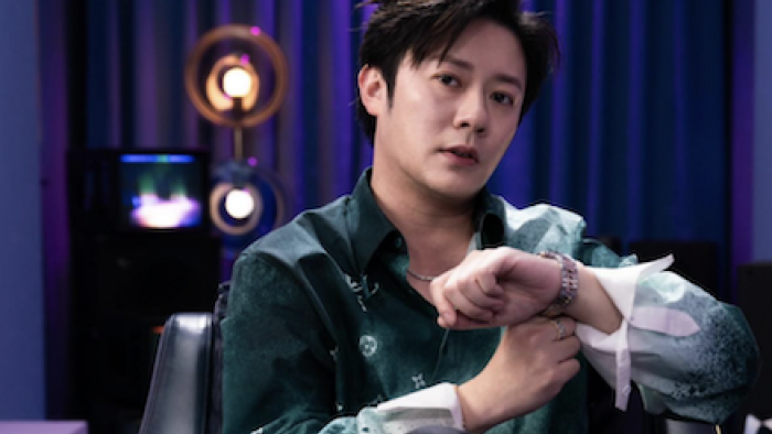 Super Rich in Korea TV show screenshot 3: David Yong adjusts a shirt sleeve.
