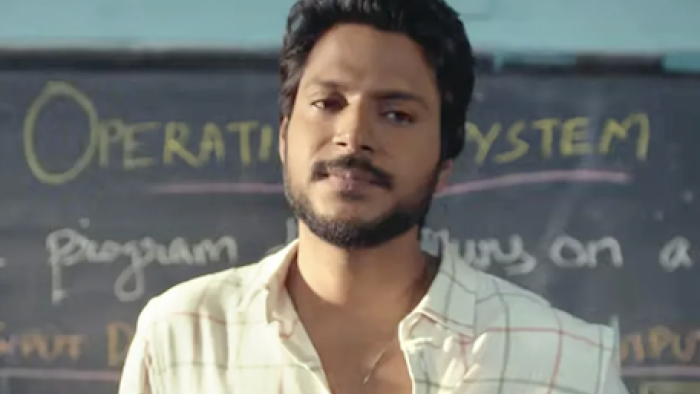 Super Subbu TV show screenshot 1: Subbu in a classroom, standing in front of a chalkboard with notes.