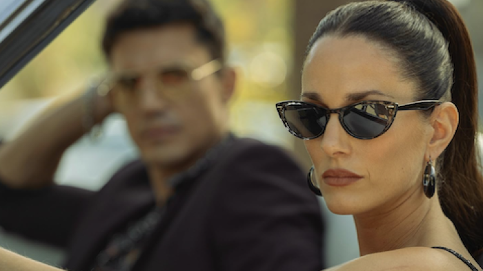 Suspicious Minds TV show screenshot 1: Amber in sunglasses sitting next to Rui in car. 