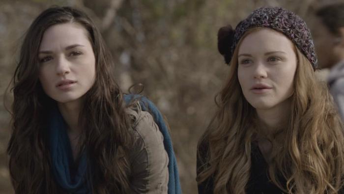 Two young White women with long hair, one wearing a crocheted knit cap