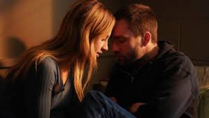 Tell Me Lies TV show screenshot: A young White couple touches their heads together in a romantic gesture.