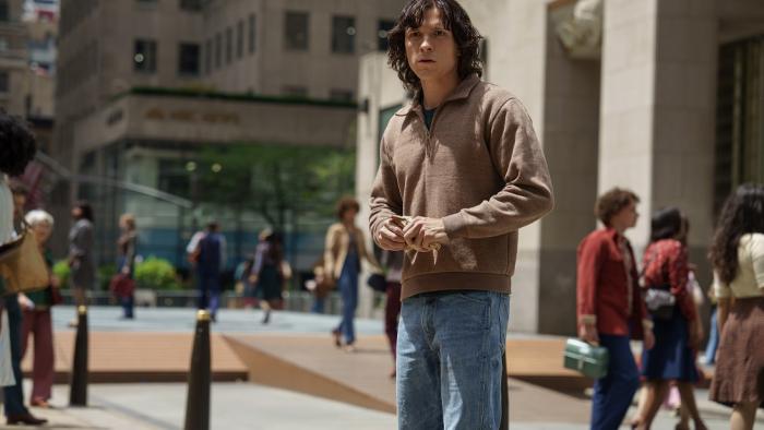 The Crowded Room: Tom Holland stands outside, shocked.