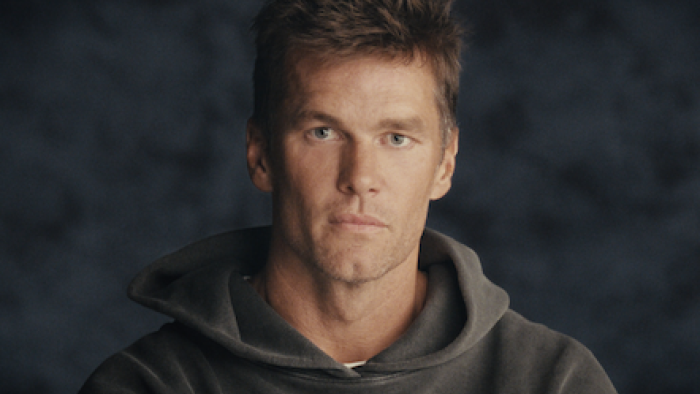 The Dynasty: New England Patriots screenshot 1: Tom Brady in dark grey sweater.