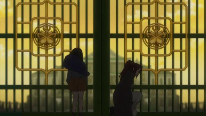 The Fire Hunter TV show: Touko and another girl can be seen standing in front of a large green gate that has a golden emblem, the gate is closed and in the far distance you can see a palace.