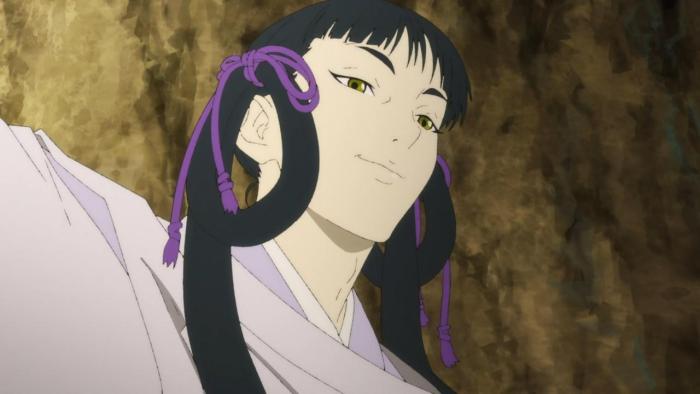 The Fire Hunter TV show: Hibari is seen standing in a rocky cave, they are wearing a lavender kimono, and they have pigtails tied up with purple cords.